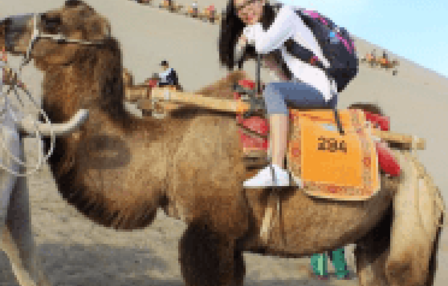 A woman riding a camel